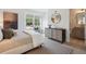 Spacious bedroom with a dresser, a comfy bed, and an ensuite bathroom at 735 Opal Wing St, Moncks Corner, SC 29461