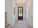 Bright entryway with hardwood floors and a view to the backyard at 735 Opal Wing St, Moncks Corner, SC 29461