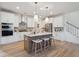 Modern kitchen with white cabinets, stainless steel appliances, and an island at 735 Opal Wing St, Moncks Corner, SC 29461