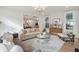 Spacious living room with hardwood floors and neutral decor at 735 Opal Wing St, Moncks Corner, SC 29461