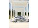 White pergola provides shade for lounge chairs near pool at 735 Opal Wing St, Moncks Corner, SC 29461
