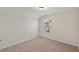 Bright bedroom featuring a window with blinds and neutral decor at 767 Opal Wing St, Moncks Corner, SC 29461