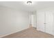 Well-lit bedroom, neutral walls and carpet, double doors at 767 Opal Wing St, Moncks Corner, SC 29461