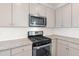 Stainless steel appliances and granite countertops in this kitchen at 767 Opal Wing St, Moncks Corner, SC 29461
