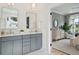 Elegant bathroom with double vanity and view into bedroom at 775 Opal Wing St, Moncks Corner, SC 29461