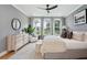 Spacious bedroom with large windows, plush bed, and ample dresser space at 775 Opal Wing St, Moncks Corner, SC 29461