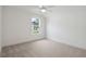 Spacious bedroom with neutral carpeting and large window at 775 Opal Wing St, Moncks Corner, SC 29461