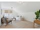 Bright bonus room with vaulted ceiling, comfy seating, and workspace at 775 Opal Wing St, Moncks Corner, SC 29461