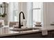 Modern kitchen sink and faucet with marble countertop at 775 Opal Wing St, Moncks Corner, SC 29461