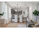 Modern kitchen with gray cabinets, marble countertops, and stainless steel appliances at 775 Opal Wing St, Moncks Corner, SC 29461