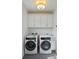 Laundry room with washer, dryer, and white cabinets at 775 Opal Wing St, Moncks Corner, SC 29461