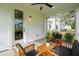 Screened porch with white siding and access door at 775 Opal Wing St, Moncks Corner, SC 29461