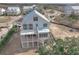 Home's rear elevation; deck and marsh views at 815 Dunham St, Charleston, SC 29492