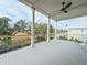 Deck overlooks marsh with cable railing and ceiling fan at 815 Dunham St, Charleston, SC 29492