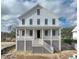 Two-story home with white siding and metal roof at 815 Dunham St, Charleston, SC 29492