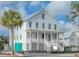 Two-story home with white siding, metal roof, and front porch at 815 Dunham St, Charleston, SC 29492