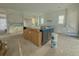 Spacious kitchen with large island, under-cabinet lighting, and white cabinetry at 815 Dunham St, Charleston, SC 29492