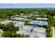Aerial view of multiple tennis courts surrounded by lush greenery at 815 Dunham St, Charleston, SC 29492