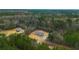 Aerial view of a new manufactured home nestled in a quiet wooded setting at 857 Devines Way, Cross, SC 29436