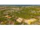 Aerial view of a community with several manufactured homes and surrounding woodland at 857 Devines Way, Cross, SC 29436