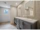 Double vanity bathroom with gray cabinets and large mirrors at 857 Devines Way, Cross, SC 29436
