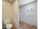 Bathroom with toilet and walk-in closet with wire shelving at 857 Devines Way, Cross, SC 29436