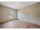 Spacious bedroom with large window and wood-look flooring at 857 Devines Way, Cross, SC 29436