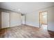 Spacious bedroom with wood-look flooring and an adjoining bathroom at 857 Devines Way, Cross, SC 29436