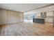 Open dining area with wood-look flooring and kitchen view at 857 Devines Way, Cross, SC 29436