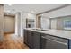 Modern kitchen with island, stainless steel dishwasher and fridge at 857 Devines Way, Cross, SC 29436