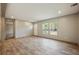 Open living room with large windows and access to the deck at 857 Devines Way, Cross, SC 29436