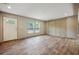 Bright living room with wood-look floors and a wood accent wall at 857 Devines Way, Cross, SC 29436