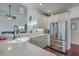 White kitchen with stainless steel appliances and quartz countertops at 8736 Herons Walk, North Charleston, SC 29420