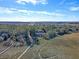 Aerial view showcasing a charming waterfront home and expansive marsh at 8934 Sandy Creek Rd, Edisto Island, SC 29438