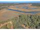 Aerial view showcasing the property's waterfront access and marshlands at 8934 Sandy Creek Rd, Edisto Island, SC 29438