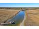 Aerial view of waterfront home with private dock and serene marsh views at 8934 Sandy Creek Rd, Edisto Island, SC 29438
