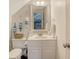 Clean and spacious bathroom with a white vanity and mirror at 8934 Sandy Creek Rd, Edisto Island, SC 29438