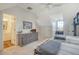 Bright bedroom with a dresser and ensuite bathroom access at 8934 Sandy Creek Rd, Edisto Island, SC 29438
