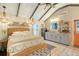 Cozy bedroom with vaulted ceiling, wicker bed frame, and stylish decor at 8934 Sandy Creek Rd, Edisto Island, SC 29438