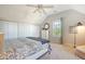 Bedroom with a floral comforter and ceiling fan at 8934 Sandy Creek Rd, Edisto Island, SC 29438