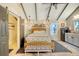 Main bedroom with vaulted ceiling and a small kitchenette at 8934 Sandy Creek Rd, Edisto Island, SC 29438