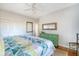 Bedroom with king bed, green dresser, and white closet doors at 8934 Sandy Creek Rd, Edisto Island, SC 29438