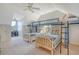 Upstairs bedroom with twin beds, a desk and a view at 8934 Sandy Creek Rd, Edisto Island, SC 29438