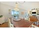 Farmhouse style dining room with a large wooden table and chandelier at 8934 Sandy Creek Rd, Edisto Island, SC 29438