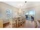 Spacious dining area with a wooden table and access to a deck at 8934 Sandy Creek Rd, Edisto Island, SC 29438