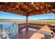 Relaxing waterfront dock with covered seating area, offering scenic views at 8934 Sandy Creek Rd, Edisto Island, SC 29438