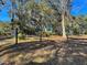 Private gated entrance to the property, showcasing mature trees at 8934 Sandy Creek Rd, Edisto Island, SC 29438