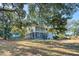 Two story home with wrap around porch and detached shed at 8934 Sandy Creek Rd, Edisto Island, SC 29438