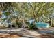 Two-story home with detached studio, surrounded by mature trees at 8934 Sandy Creek Rd, Edisto Island, SC 29438