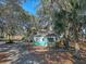 Quaint guest house with screened porch, located on a tree-lined property at 8934 Sandy Creek Rd, Edisto Island, SC 29438